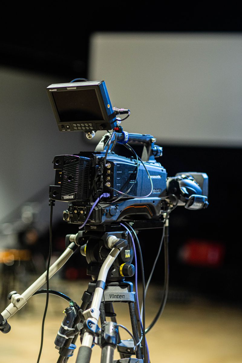 Film camera on a tripod in a studio